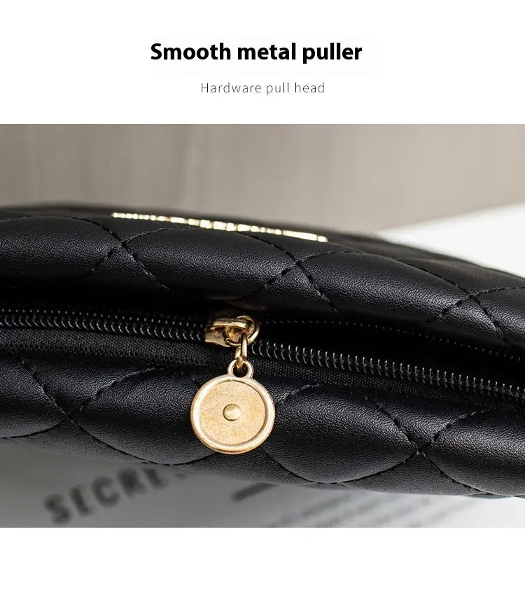 Black quilted leather chain messenger bag featuring a gold-toned metal zipper pull with circular charm and a striped crossbody strap.