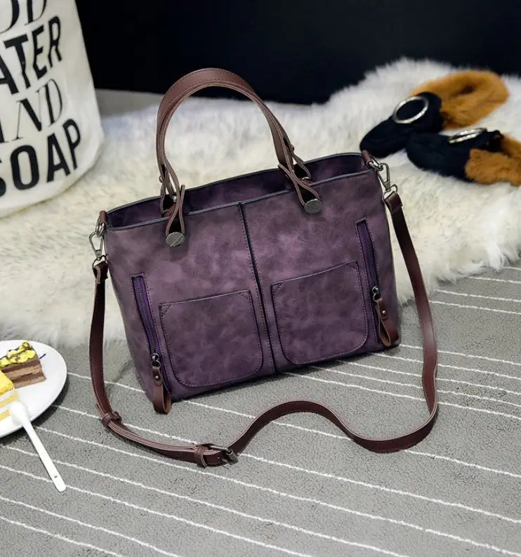 Purple suede retro large capacity leather tote crossbody bag with brown leather handles and strap.