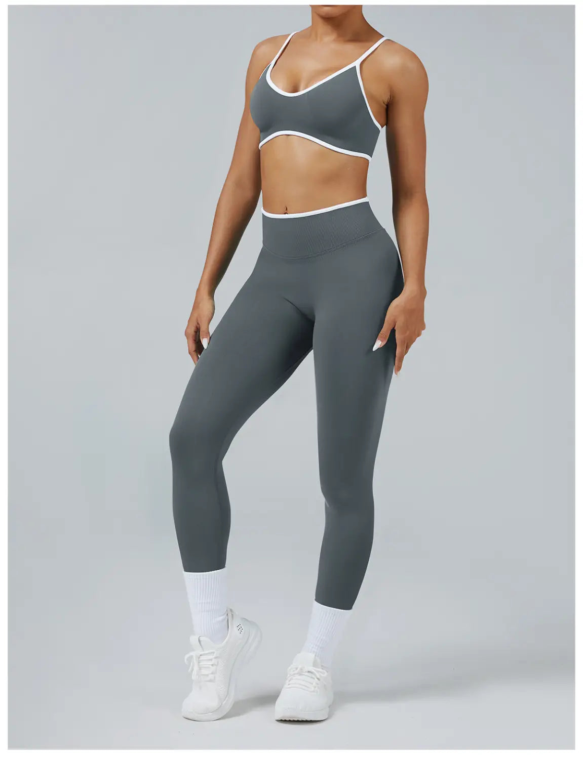 Seamless high waist sports yoga leggings in gray with white trim along the waistband and straps.