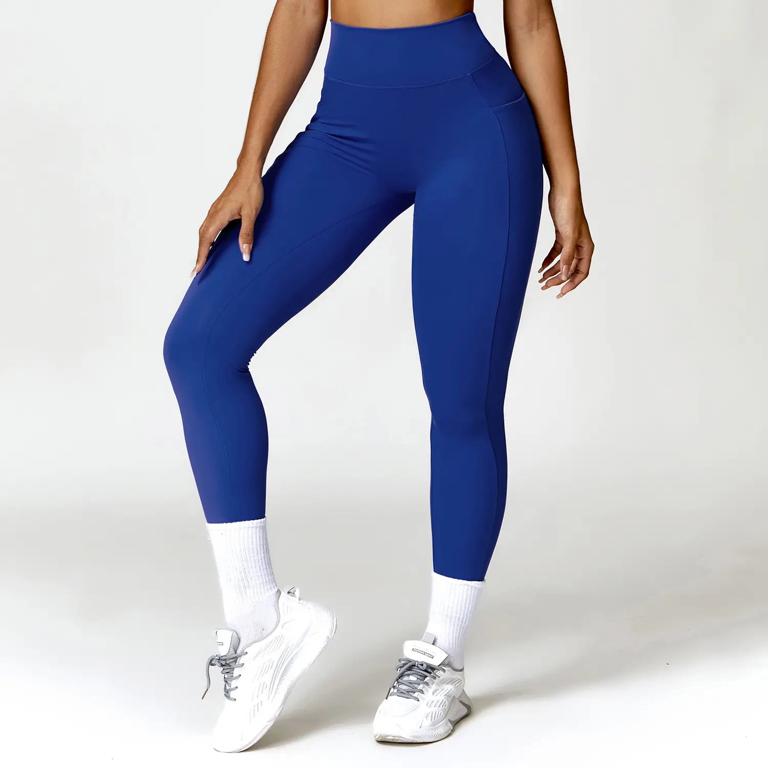 Royal blue elite high waisted athletic leggings made of smooth form-fitting stretch fabric.