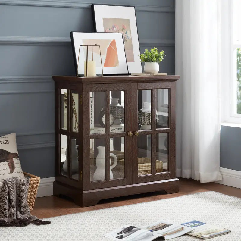 led curio display cabinet made of dark brown wood with glass doors, gold-toned handles, and adjustable shelves for elegant showcasing.