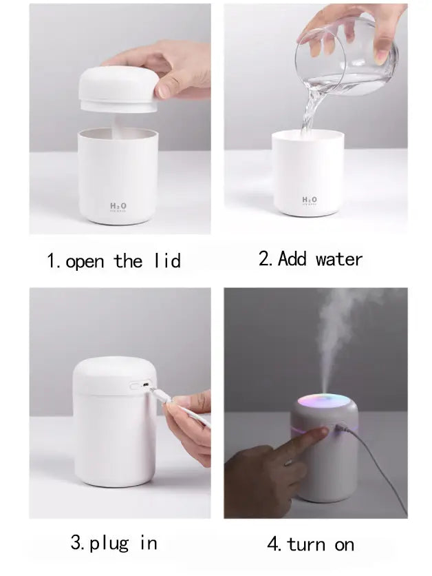 white cylindrical ultrasonic mini humidifier with sleek minimalist design and subtle rainbow led light around the base with 300ml capacity