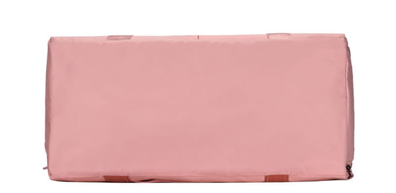 Pink rectangular waterproof oxford travel duffel bag with reinforced corners and brown fabric straps for gym and sports use.