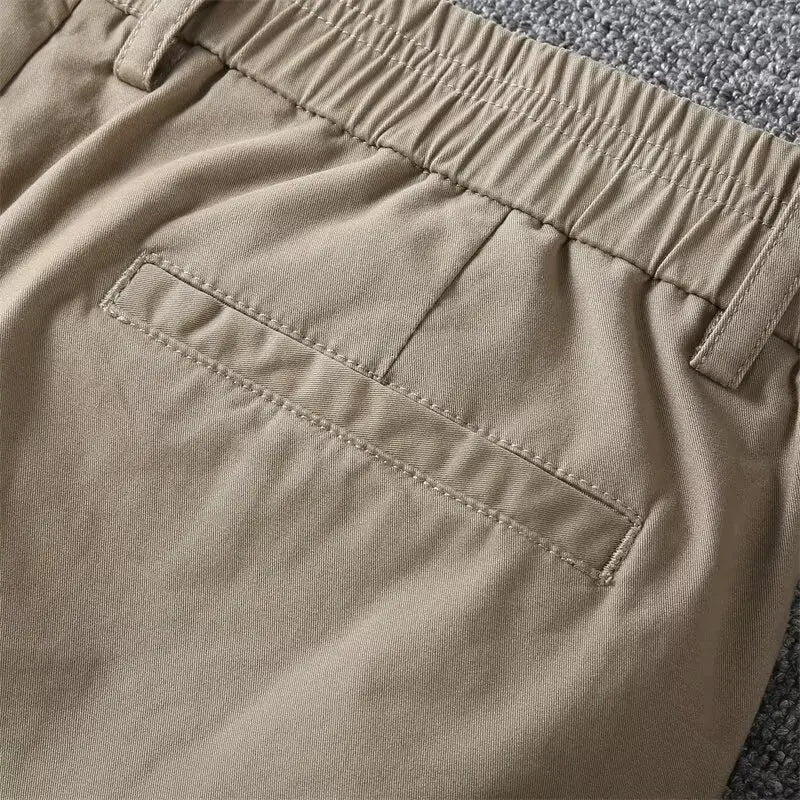 Men casual slim fit cargo shorts in khaki color with relaxed fit elastic waistband and a single front pocket.
