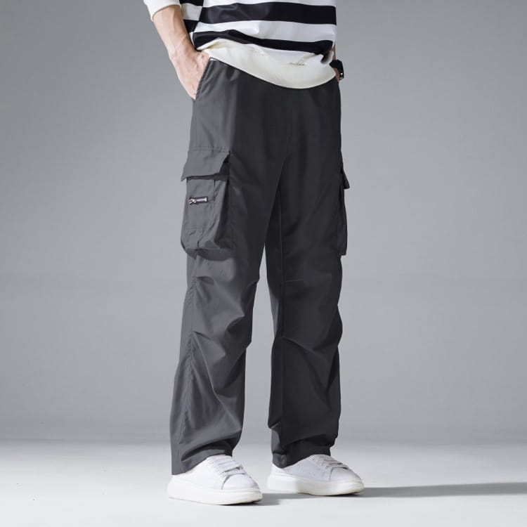 Mens multi pocket cargo workwear pants in dark gray with multiple pockets and a relaxed fit designed for durability and comfort.