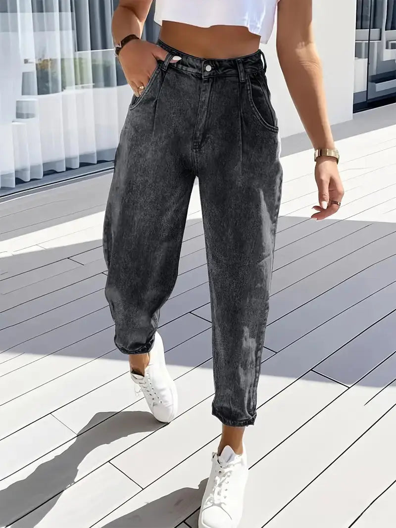 Plus size retro washed tapered denim jeans in high-waisted dark gray denim with a faded distressed wash and cuffed hems.