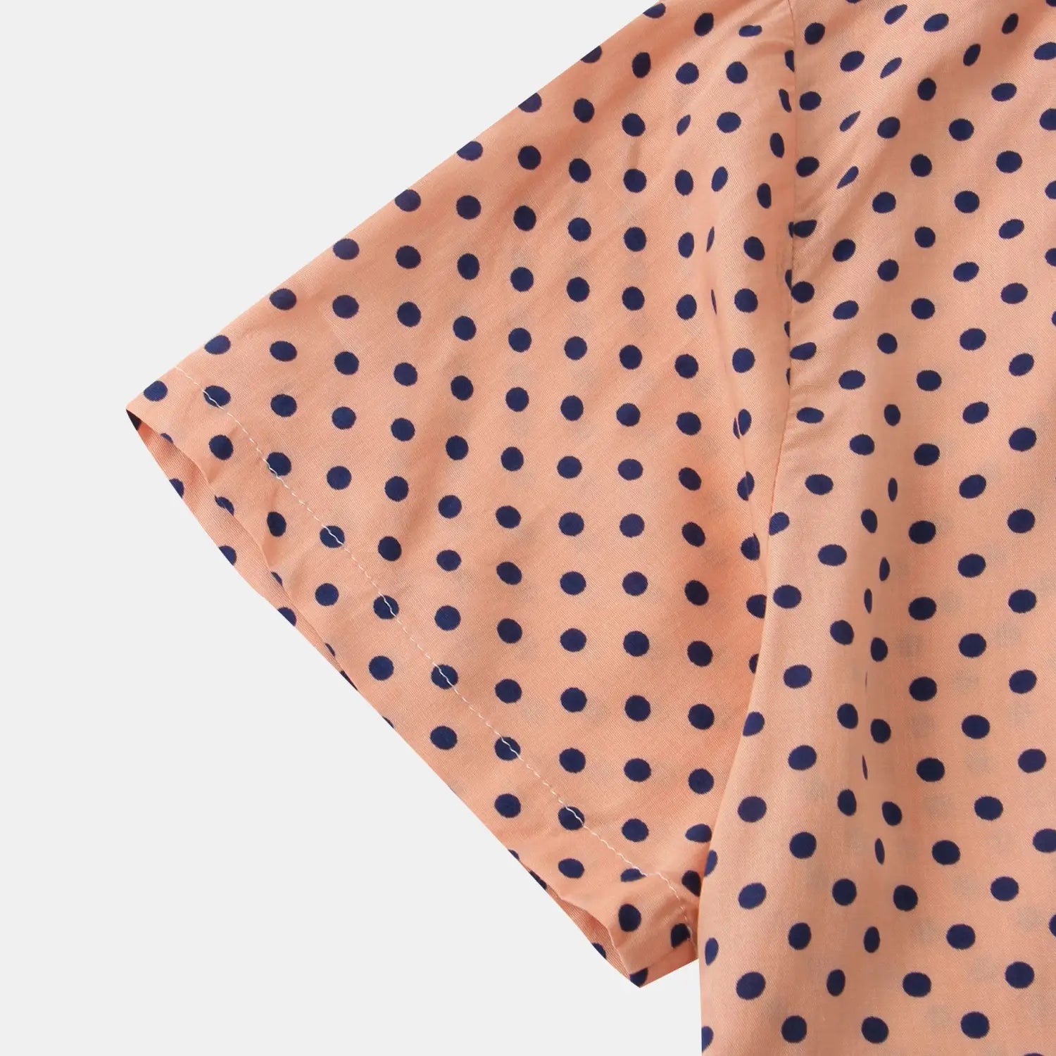 Men plus size button up shirt in peach with a navy blue polka dot pattern and short sleeves.