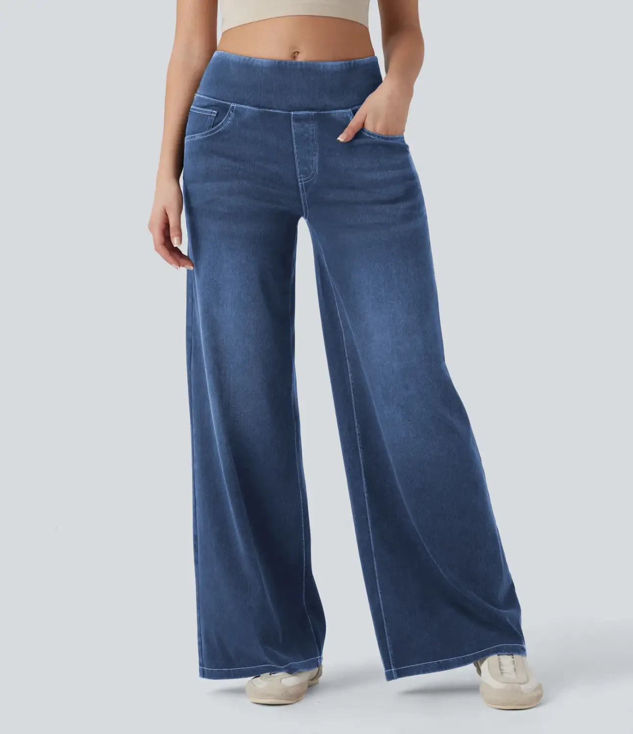 Blue wide-leg stretchy high waisted jeans made of denim with a soft slightly faded finish.