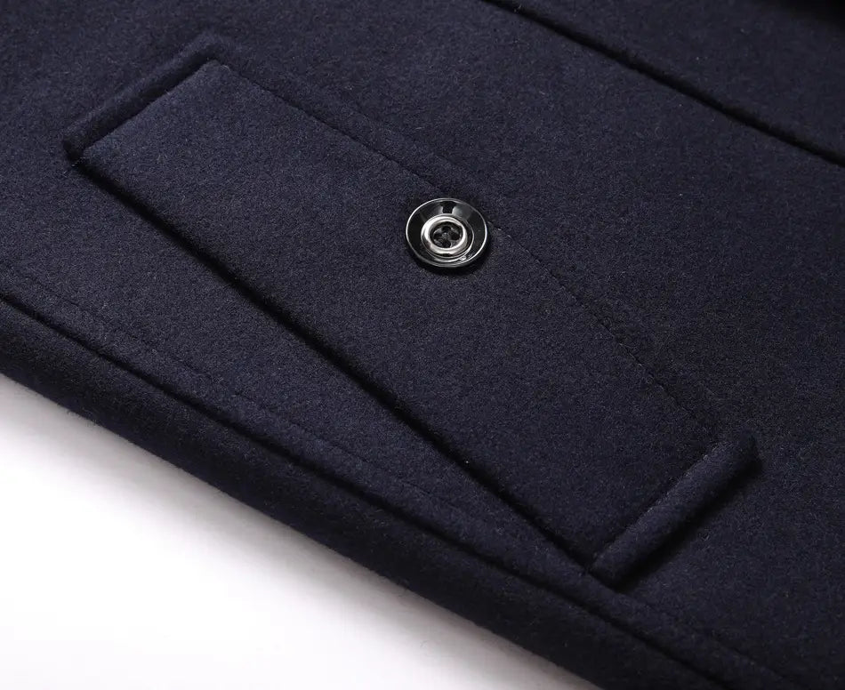 Men thickened trench coat double collar woolen outerwear in dark navy wool featuring a silver button on the flap of an inner pocket.