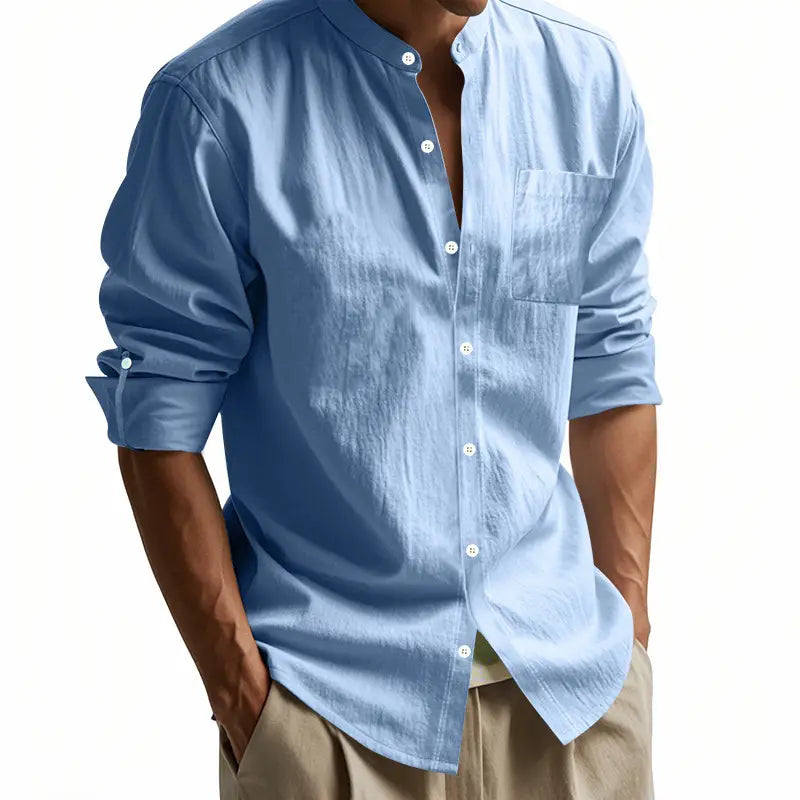 Men’s casual linen stand collar long sleeve shirt in light blue with button-down front chest pocket and rolled-up sleeves.