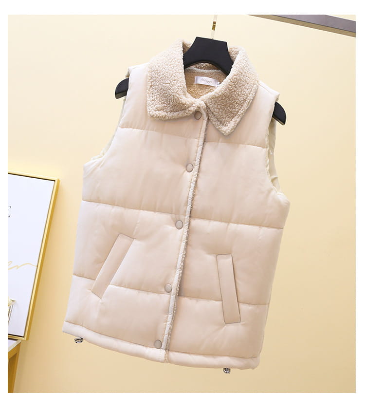 Cream-colored quilted vest for women featuring a plush fleece-lined collar and front button closure.