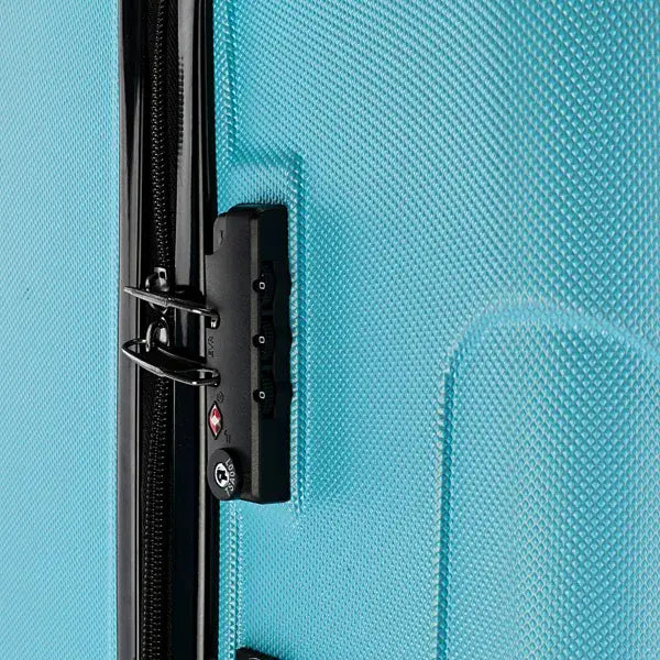Black combination lock with three dials and circular keyhole mounted on the side of a turquoise textured rolling hardshell suitcase from the 3-in-1 blue textured rolling hardshell suitcase set.