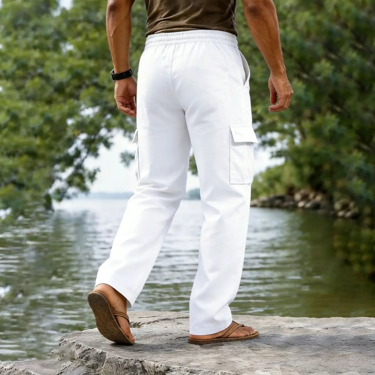 White cotton linen cargo pants for men with a relaxed fit, multiple pockets, casual straight leg, and drawstring waist.