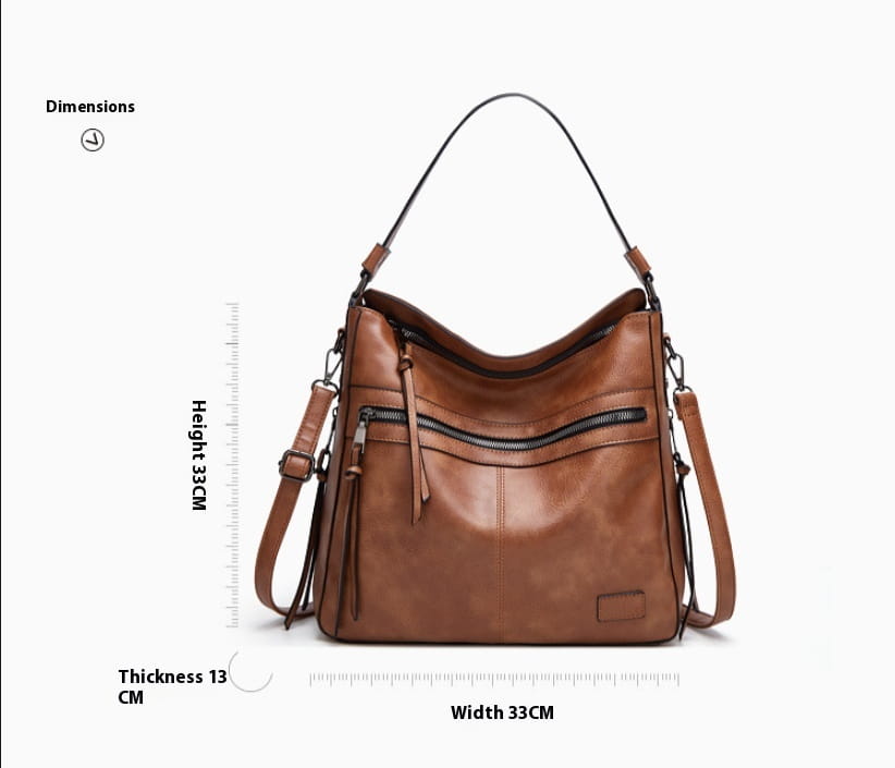 Braune Schultertasche aus Kunstleder mit schwarzen Reißverschluss-Akzenten und verstellbaren Trägern, gestaltet als Multi-Reißverschluss-Crossbody-Tote