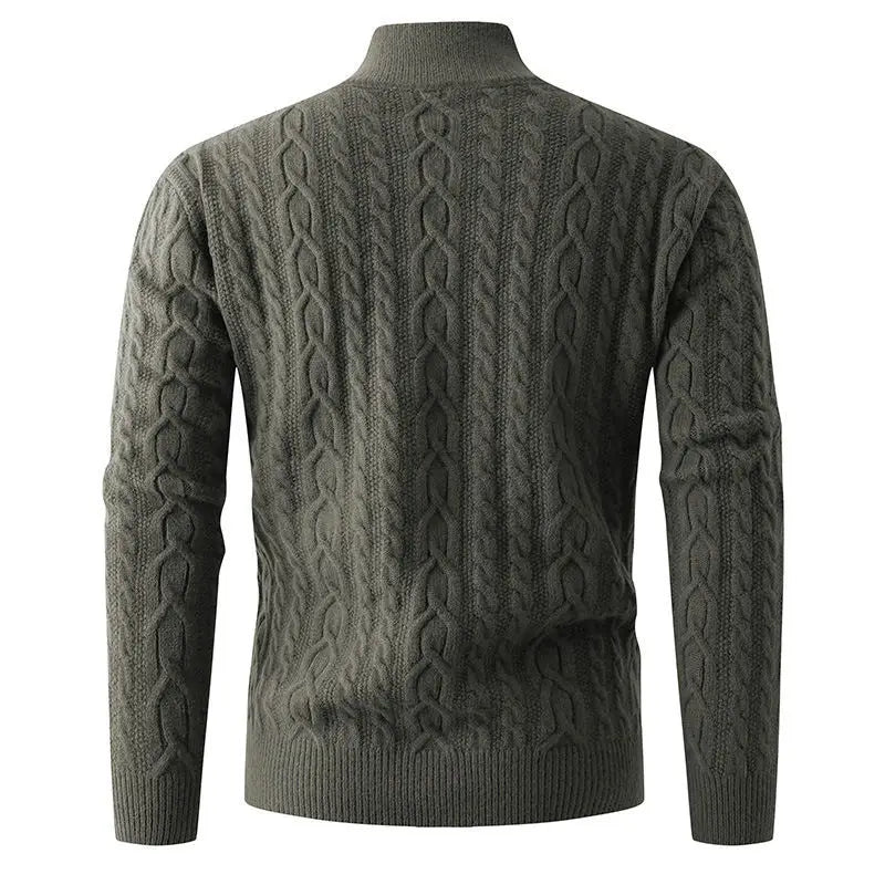 Dark olive green thick cable knit men’s sweater with ribbed turtleneck and cuffs featuring a half zip design.