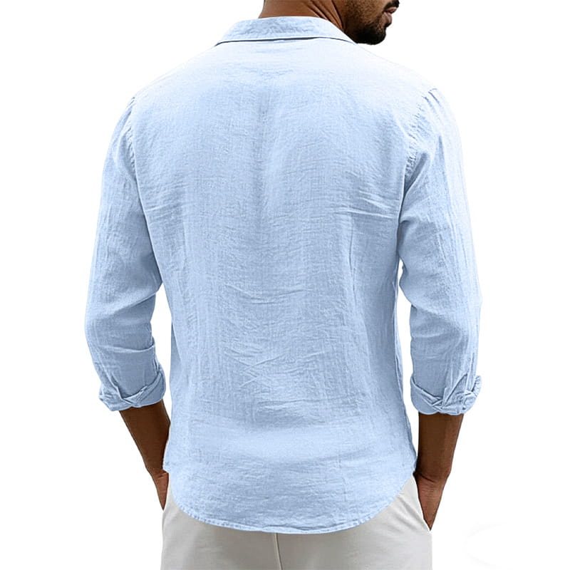 A light blue men’s slim fit linen blend long sleeve casual shirt with rolled-up sleeves and a classic collar.