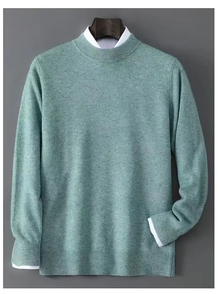 Herren-Halbkragenpullover in sanftem Mintgrün mit weißem geripptem Besatz am Kragen, an den Bündchen und am Saum aus angenehm zu tragendem Material.