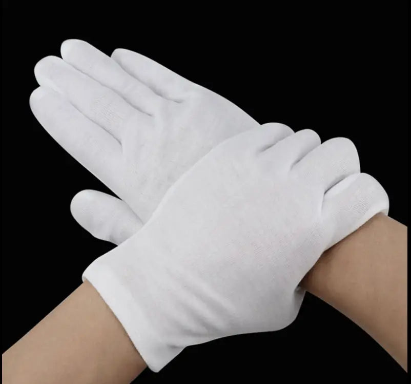 Men’s white cotton work gloves with reinforced fingertips shown from the back side featuring a snug fit and simple design.