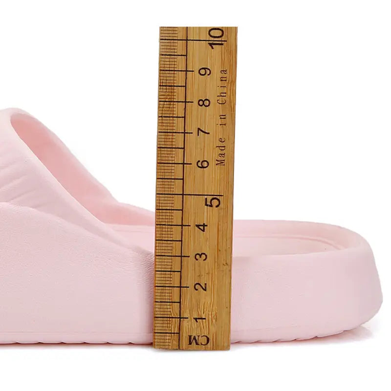 Pink rubber dog cartoon slide sandal with a soft cushioned sole and contoured footbed made of non slip Eva for house shoes.