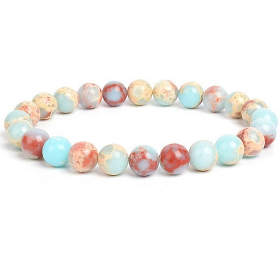 A delicate unisex 8mm polished agate and amethyst stretch bracelet composed of smooth round beads in soft turquoise and warm coral hues with subtle marbled patterns.