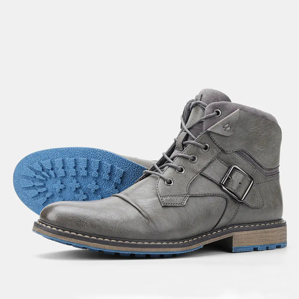 Men’s leather martin boots in gray suede with a silver buckle and blue rubber sole.