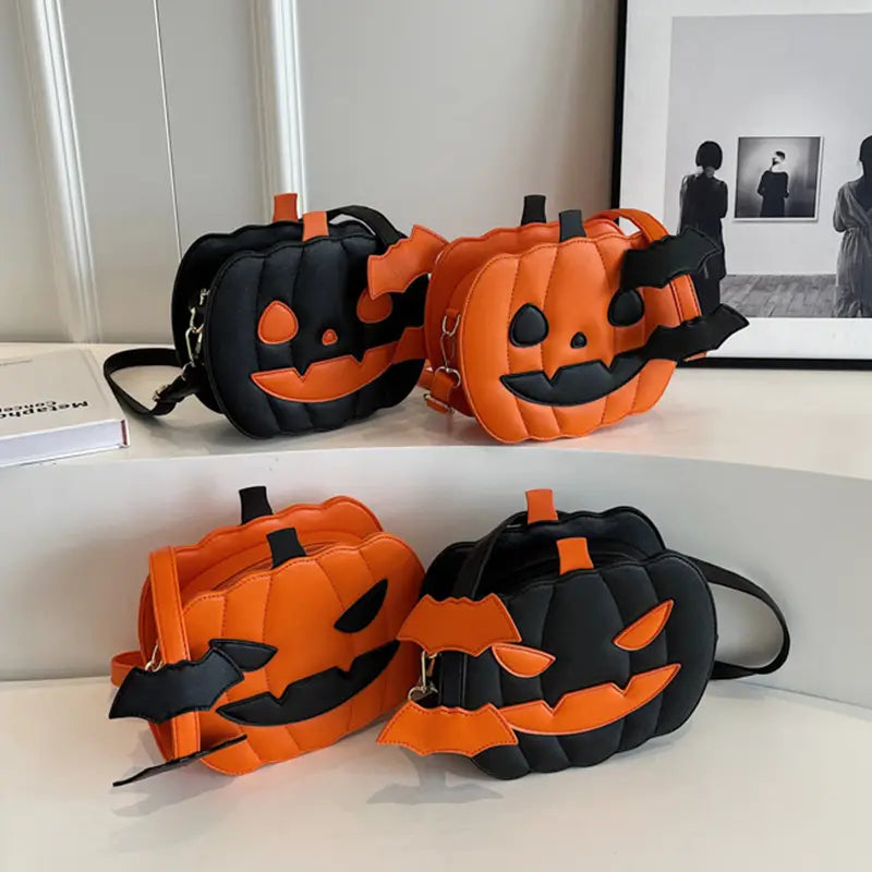 orange and black quilted pumpkin-shaped crossbody bags with bat accents and detachable charm designed for festive use