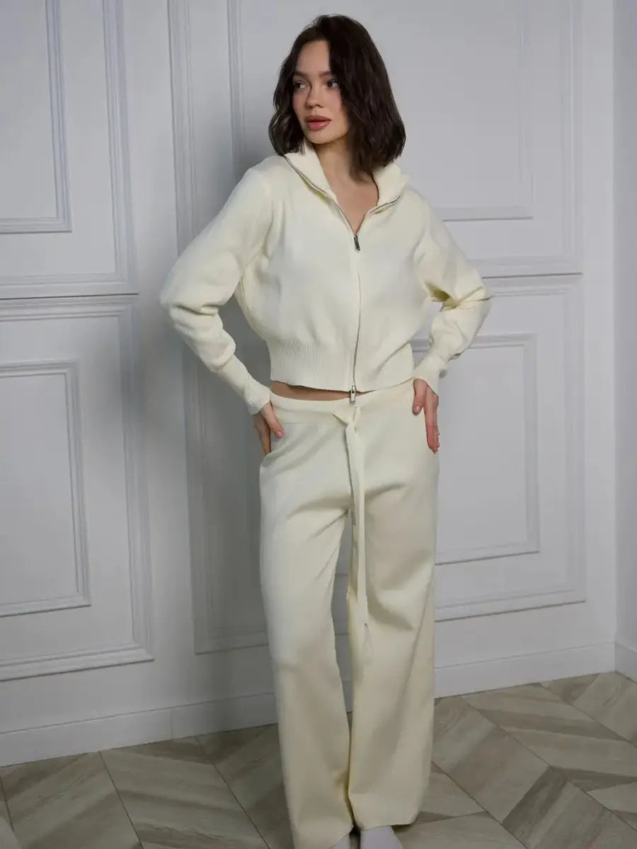 Women’s knit zip up cardigan and wide leg pant set in cream color made from soft knit fabric featuring a cropped hoodie and matching wide leg pants