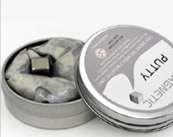 silver magnetic putty in a tin container with a small metallic cube inside from the magnetic putty stress relief toy 6 color set