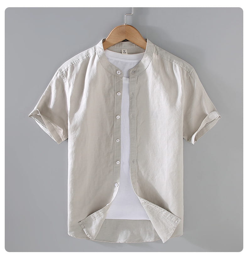 Beige men linen short sleeve shirt with mandarin collar and rolled cuffs.