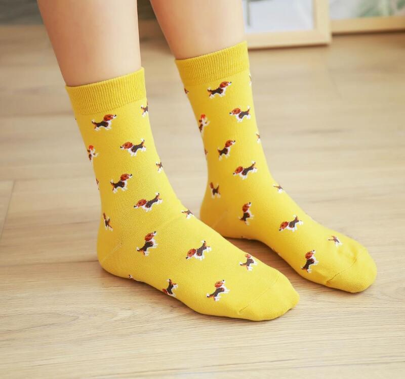 Bright yellow cotton crew socks featuring a playful pattern of beagle dogs in various poses called cute dog cartoon cotton crew socks.