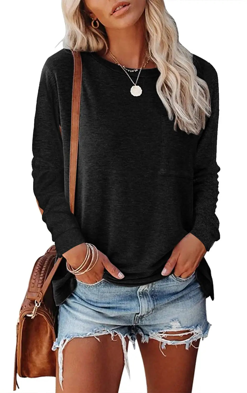 Black relaxed pocket knit long sleeve t-shirt with a relaxed fit and subtle side slits.