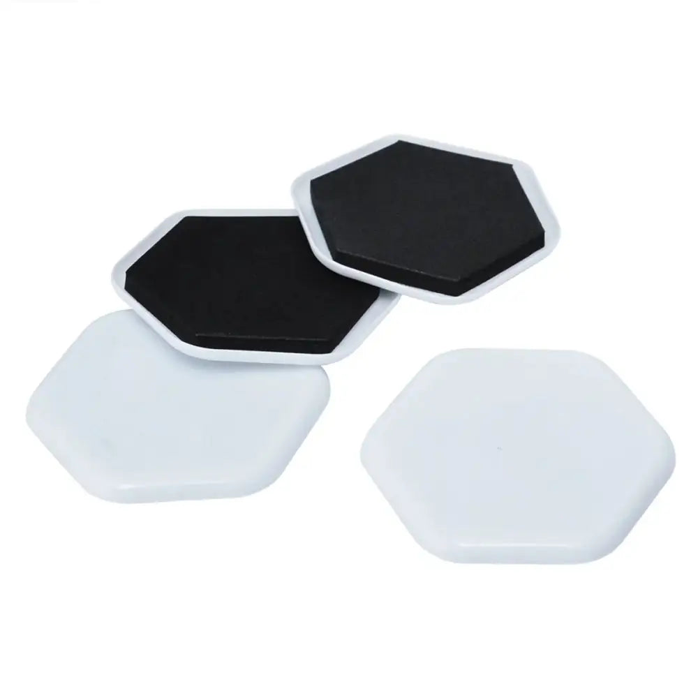 Heavy duty hexagonal furniture moving sliders in white with black adhesive backing shown from the back side