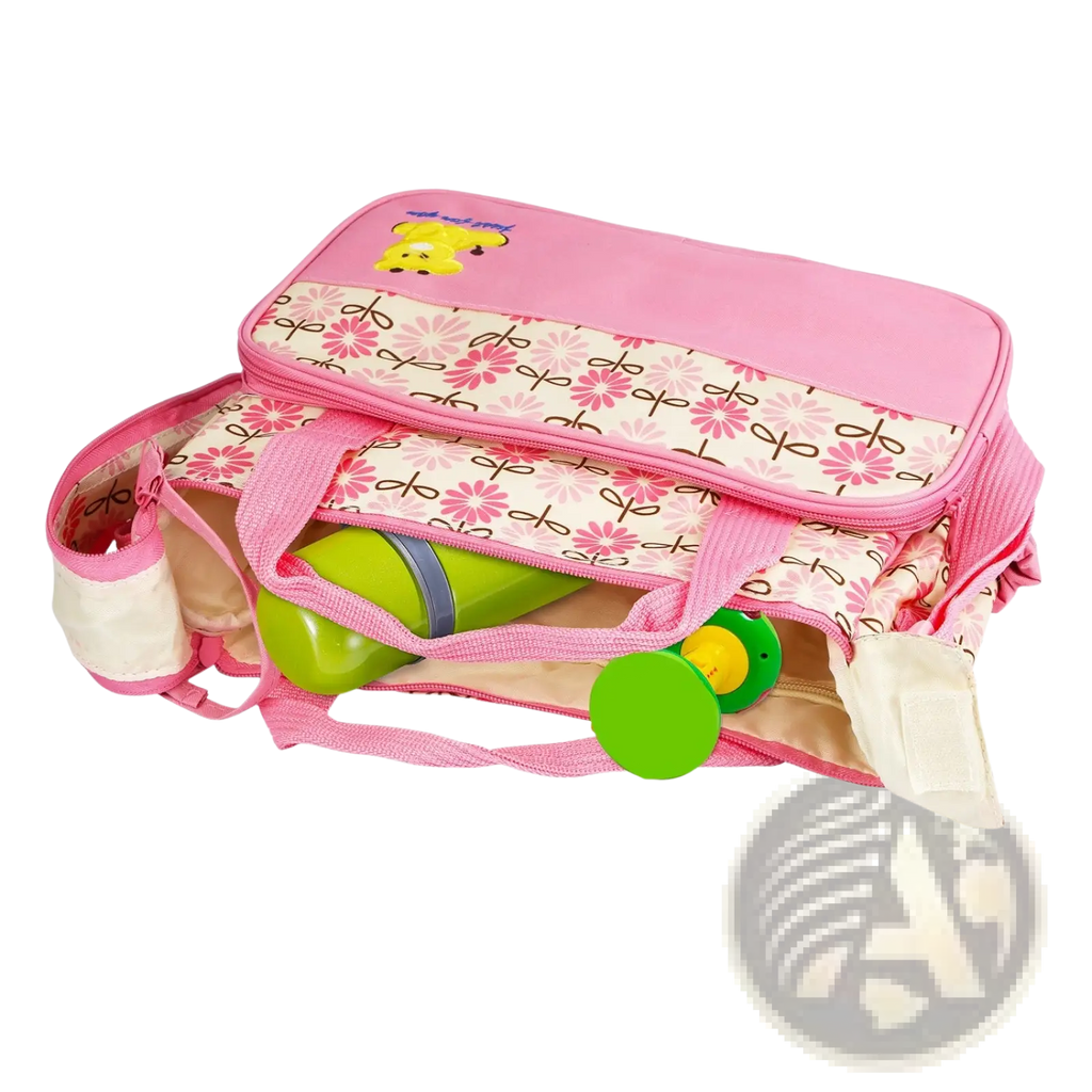 Pink baby changing bag with floral pattern and yellow bear appliqué from 5-piece water-resistant diaper bag travel set