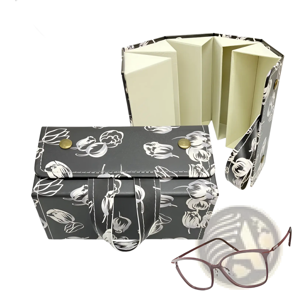 Black floral-patterned leather 5-slot folding sunglasses travel case with gold-tone snap buttons and white strap handle