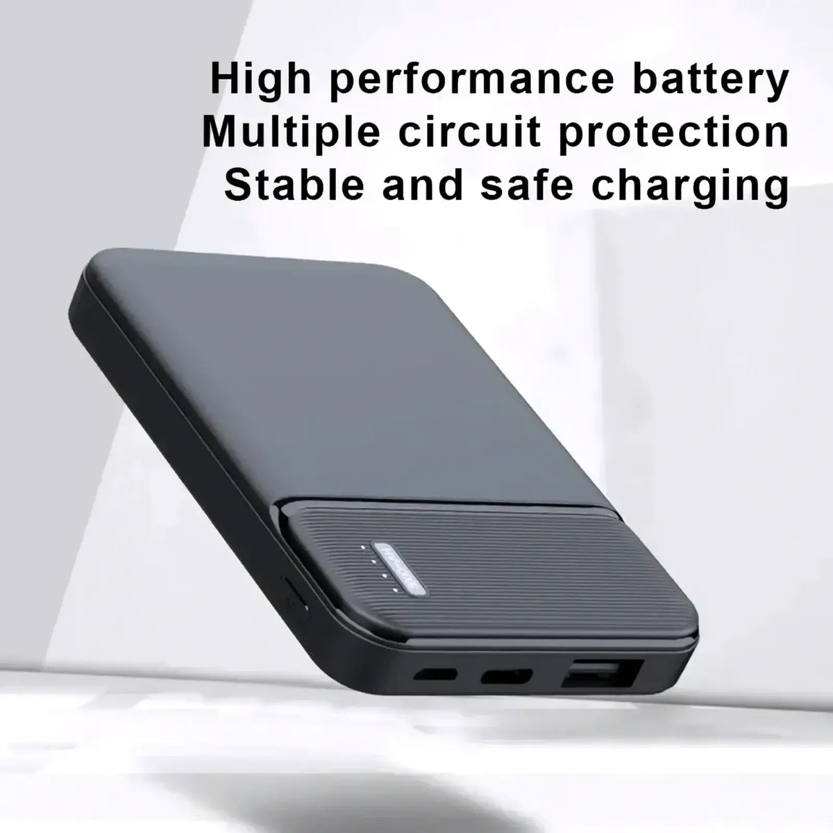 Black rectangular 5000mAh portable power bank with textured grip panel and multiple USB ports for mini charging