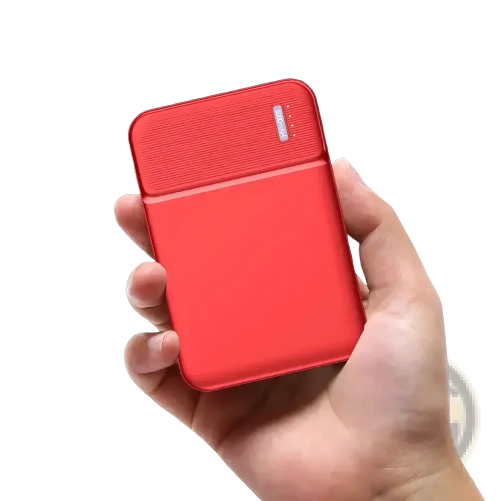 Red 5000mah portable power bank mini charger with classic design and textured top panel for efficient charging