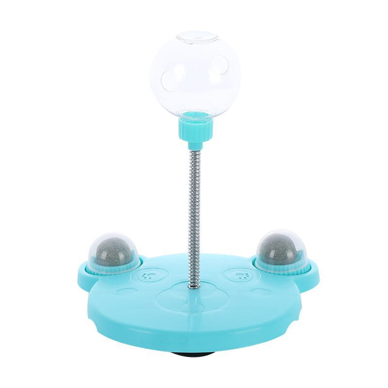 Gobelet distributeur de nourriture pour jouet puzzle en plastique bleu clair en forme de chat, avec sommet sphérique transparent, tige en métal à ressort argentée et deux compartiments latéraux contenant des billes grises texturées, avec base à ventouse.