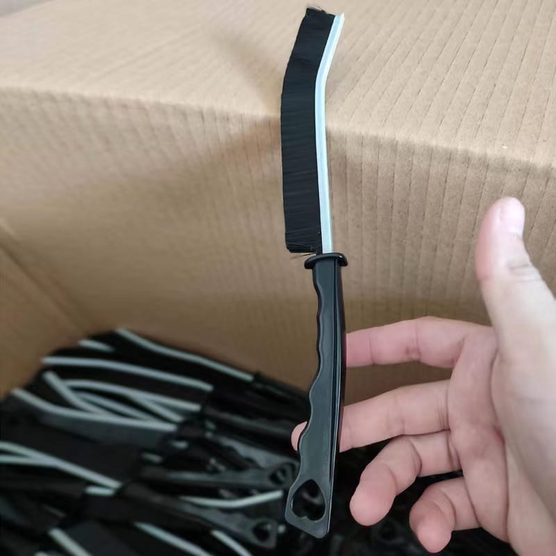 black plastic-handled gap cleaning brush with a curved black and white rubberized head designed for tile and crevice cleaning in a 5 piece set