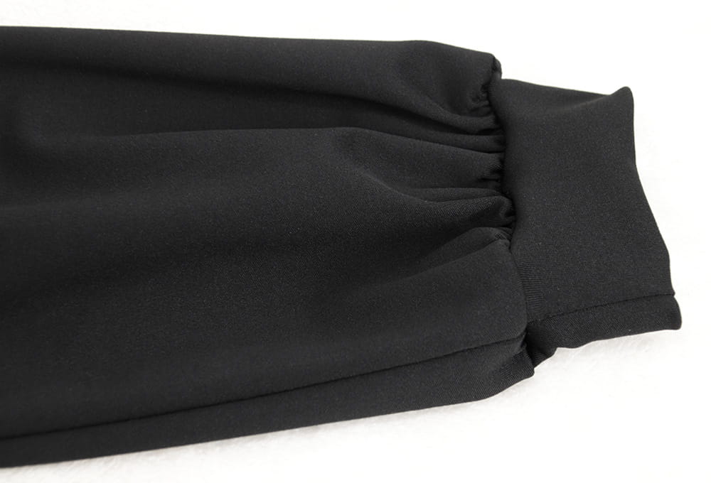 black elasticated cuff on long-sleeved velvet v-neck evening dress