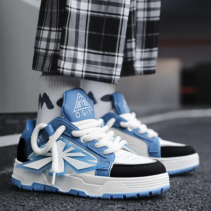 Blue and white chunky sneakers for men Harajuku low top shoes with black accents featuring a bold geometric design on the side and an embroidered logo on the tongue.