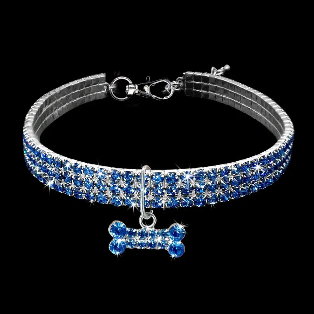 Blue rhinestone dog collar with a matching crystal bone charm designed for pet accessories.