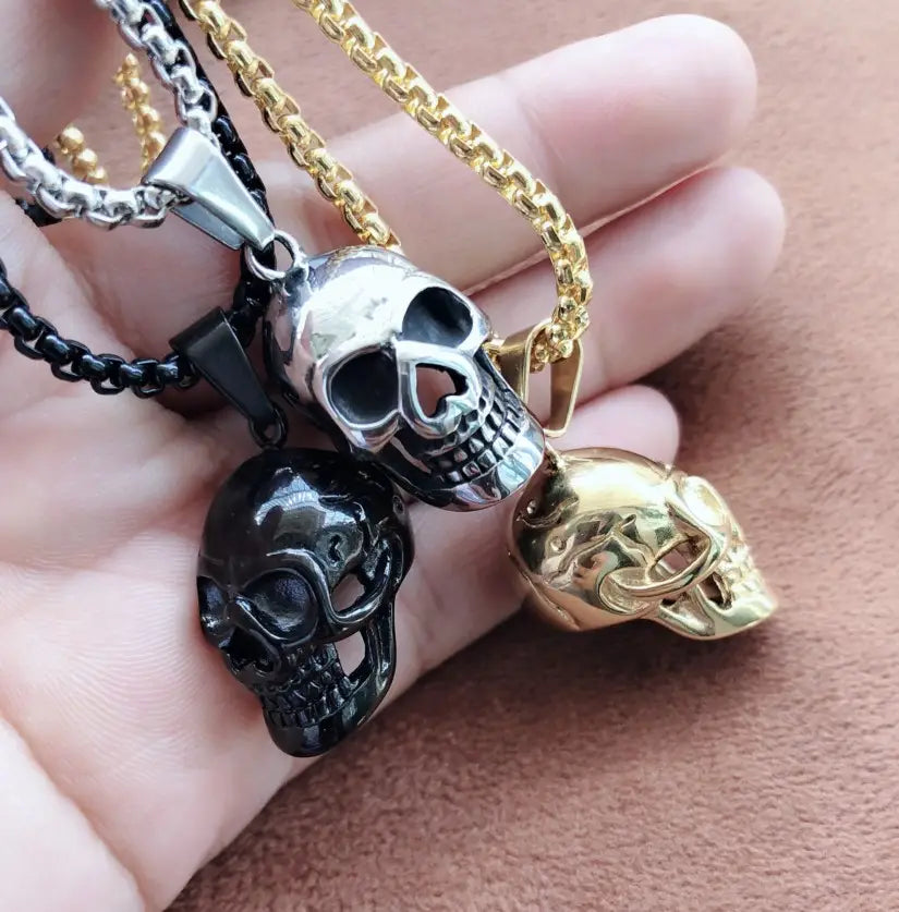 Silver skull pendant with polished reflective finish and detailed facial features made of titanium steel for men and women punk necklace.
