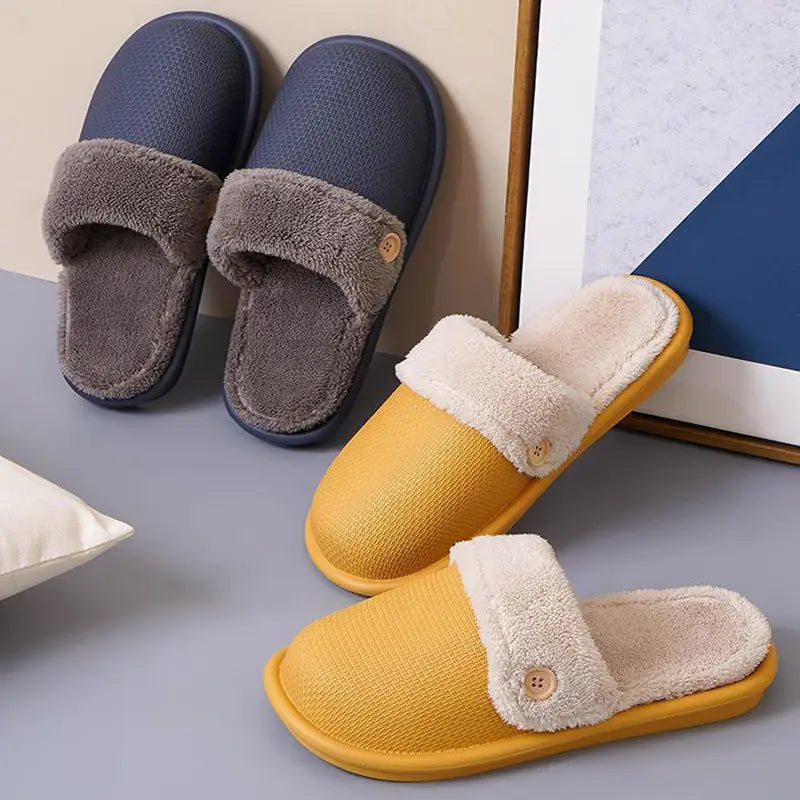Yellow and gray washable plush slip-on slippers for women featuring soft fleece lining and wooden button accents designed for winter indoor use.