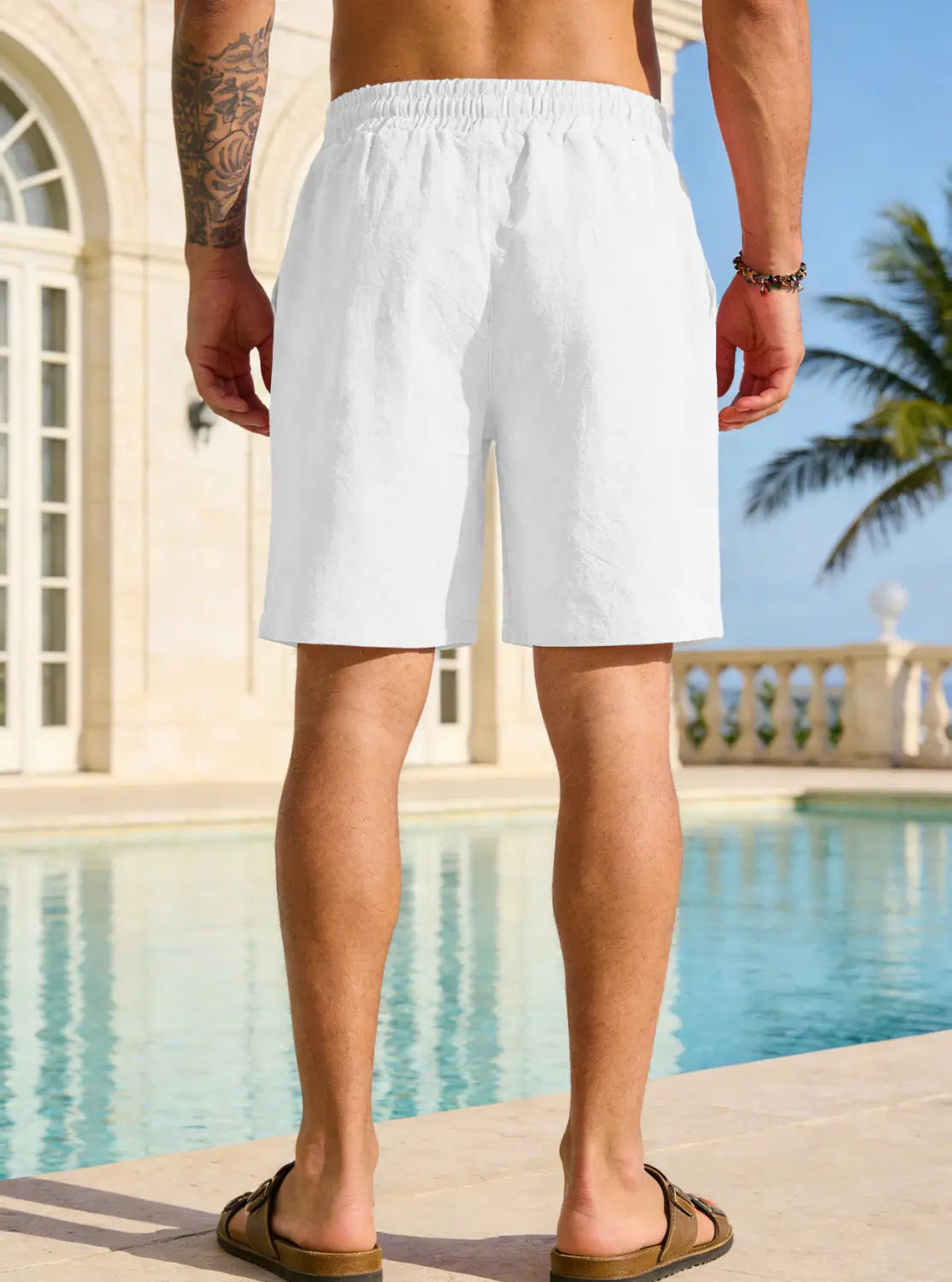Mens cotton linen drawstring shorts in white featuring an elastic waistband for comfort.