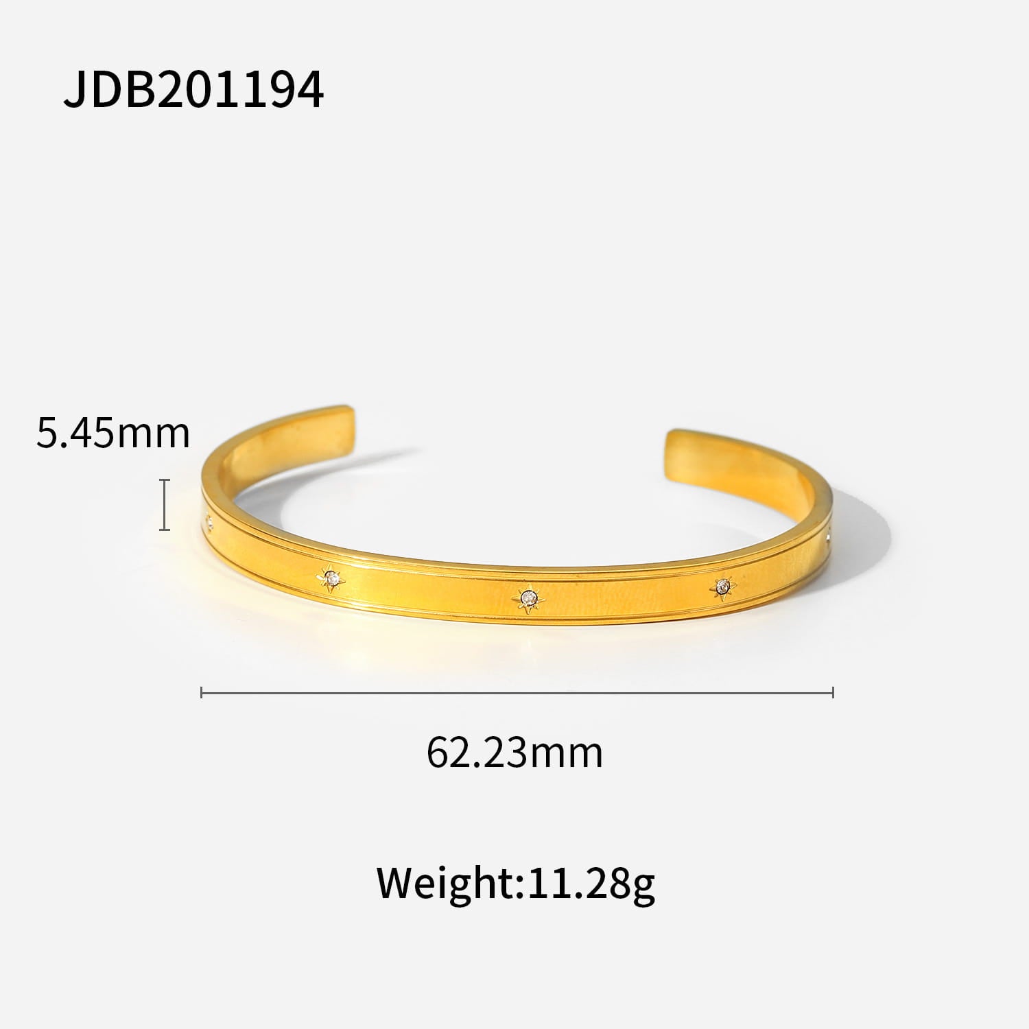 Gold plated stainless steel open cuff bangle bracelet in gold tone adorned with three small sparkling zirconia gemstones.