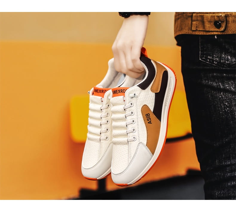 men’s casual sports sneakers non-slip microfiber shoes in white and tan with black accents and orange detailing on the heel tab and sole shown from the back side