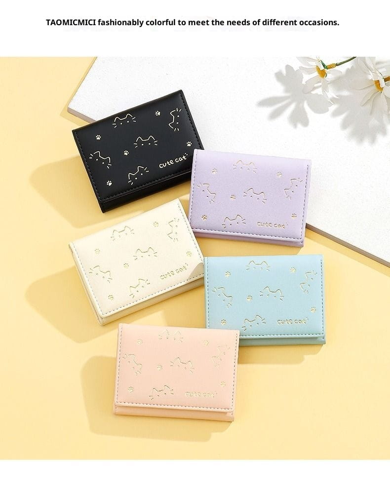 Women’s small cat print folding leather wallets in pastel and black faux leather with stitched cat-themed mini wallet designs.