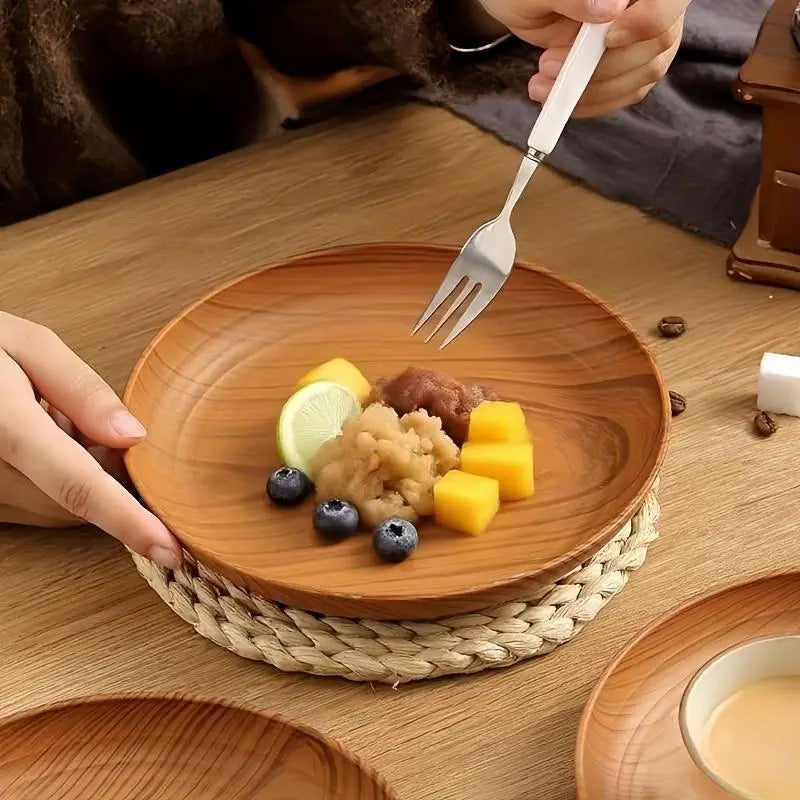 Round wooden plate with natural wood grain and smooth slightly raised rim featured in wood grain plastic plates 10pc round striped design set.