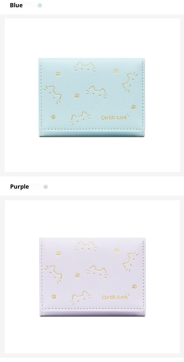 Light blue leather women’s small folding wallet featuring gold foil cat and paw print designs.