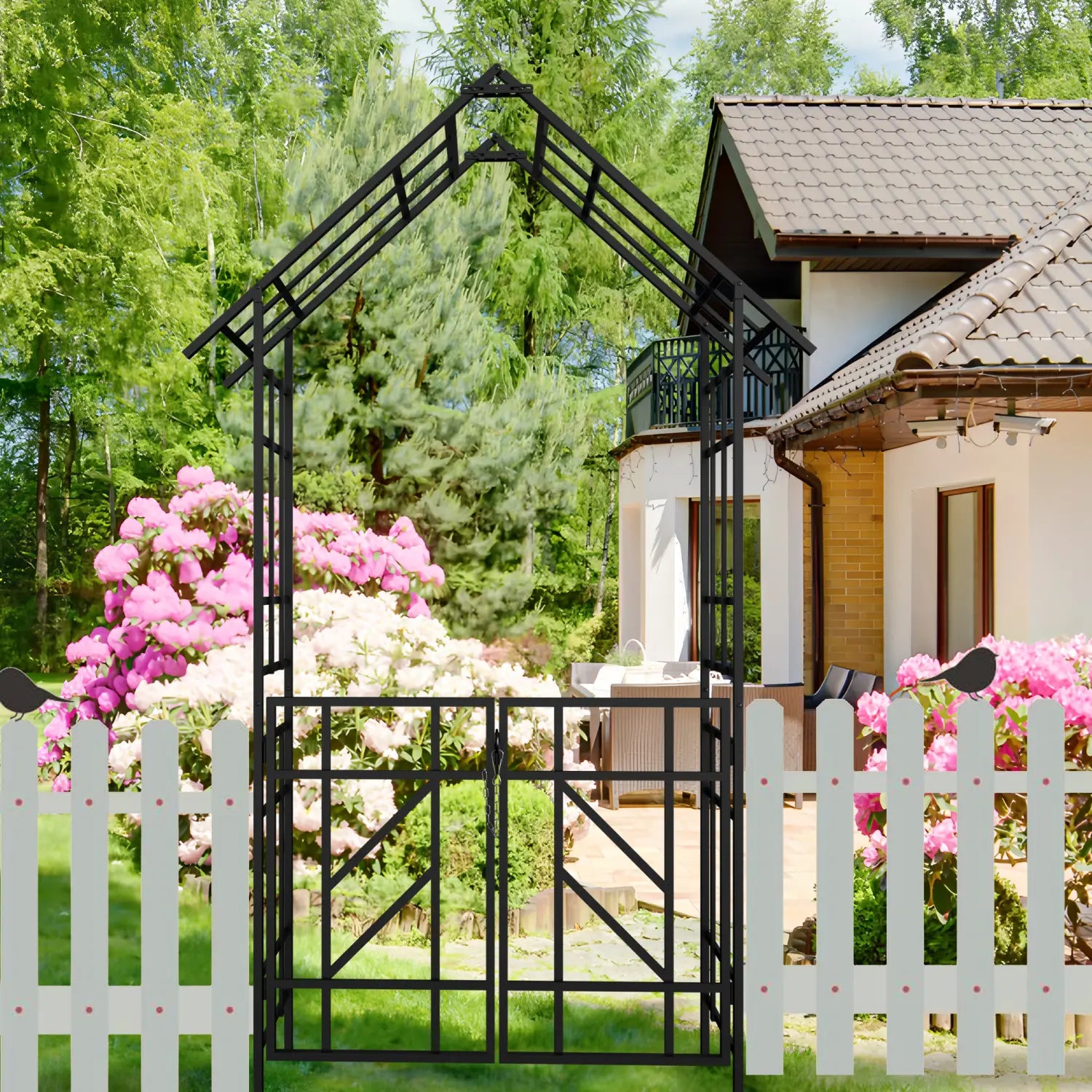 Black metal garden arbor with a house-shaped top and decorative bird cutouts on black iron fence posts in a 97 inch metal garden arch with gate trellis.